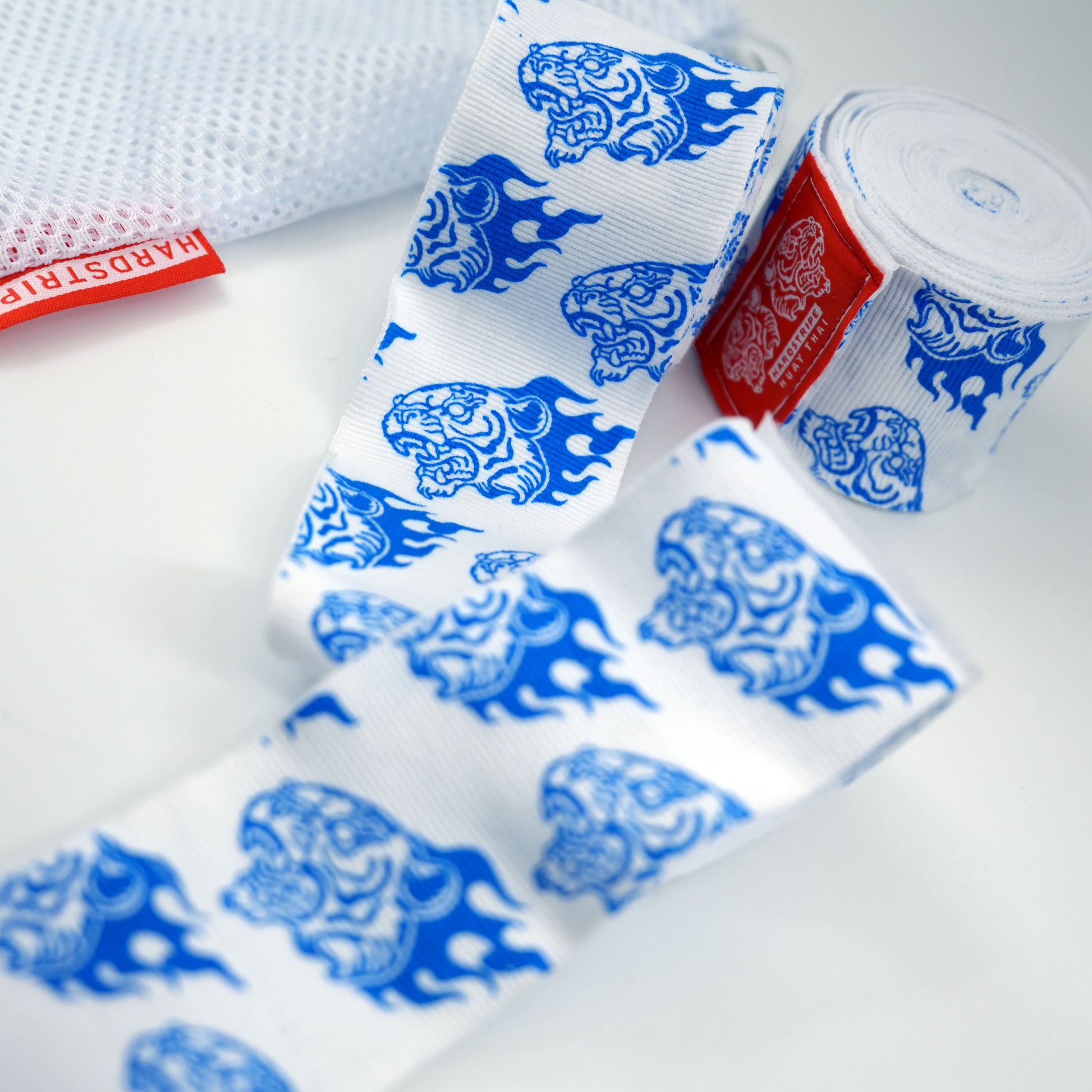 Shop the stunning Porcelain Tiger hand wraps. Features custom hand-drawn blue tiger motifs inspired by traditional fine china on a premium cotton-elastic blend. Mesh wash bag included!