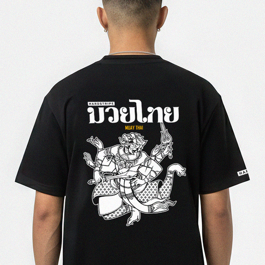 Person wearing a black t-shirt with white graphic design on the back