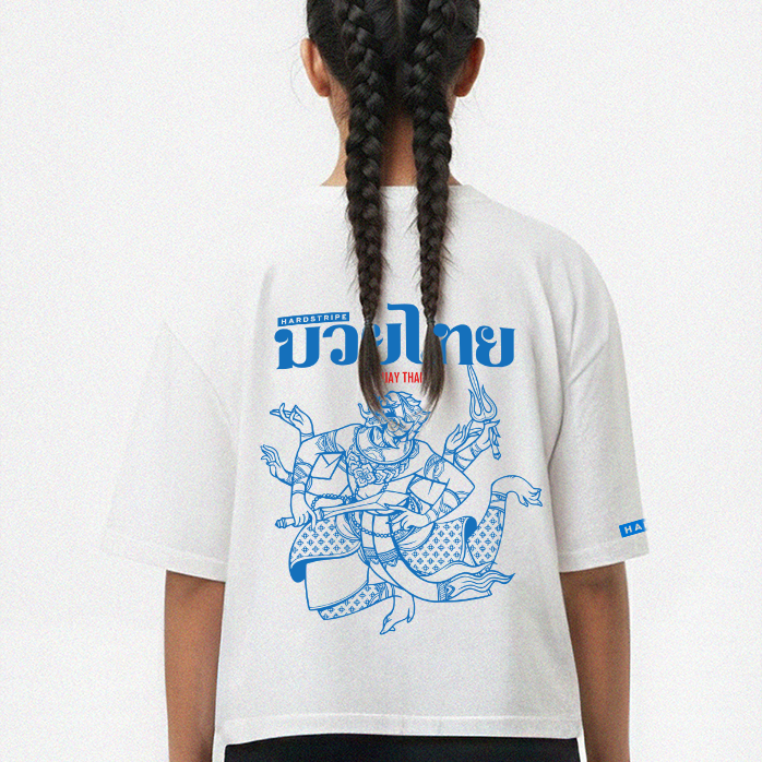 Person wearing a white t-shirt with blue graphic design on the back, standing against a white background