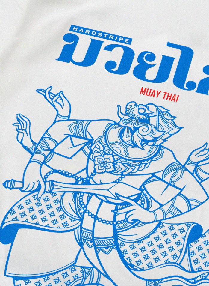 White t-shirt with blue Muay Thai design and text on a white background