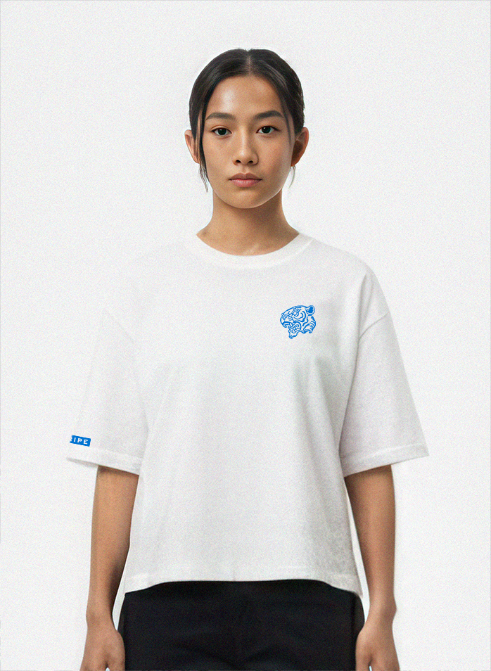 Person wearing a white t-shirt with a blue logo on a white background